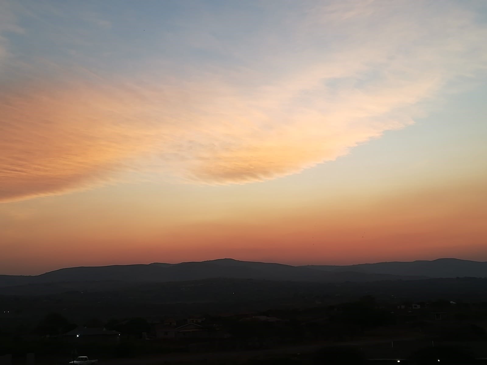 Soft misty sunrise over the Ethlathini Rest Camp property hillside, Hluhluwe KZN — the beginning of the journey